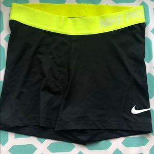 Black nike pros with yellow band